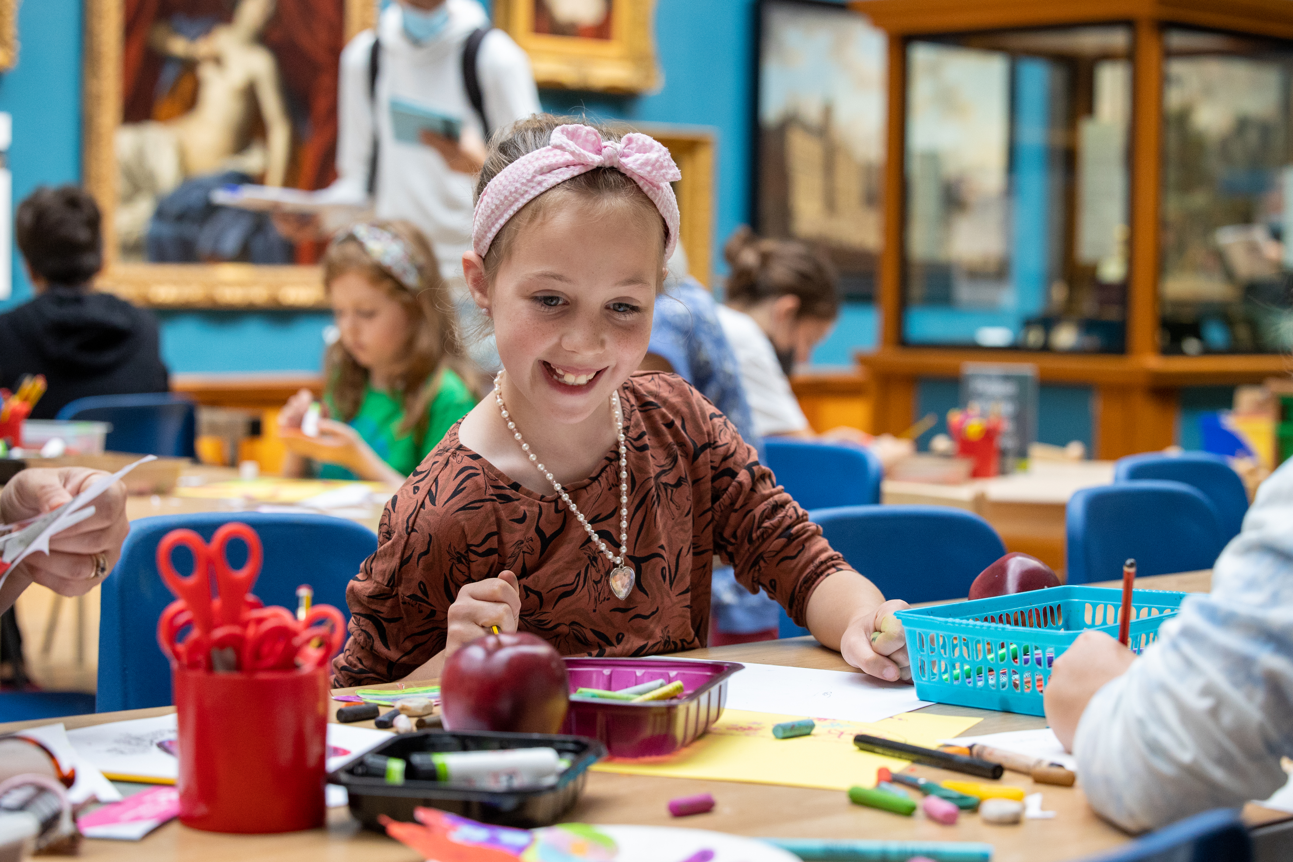 Girl doing craft activities in the Victoria Art Gallery