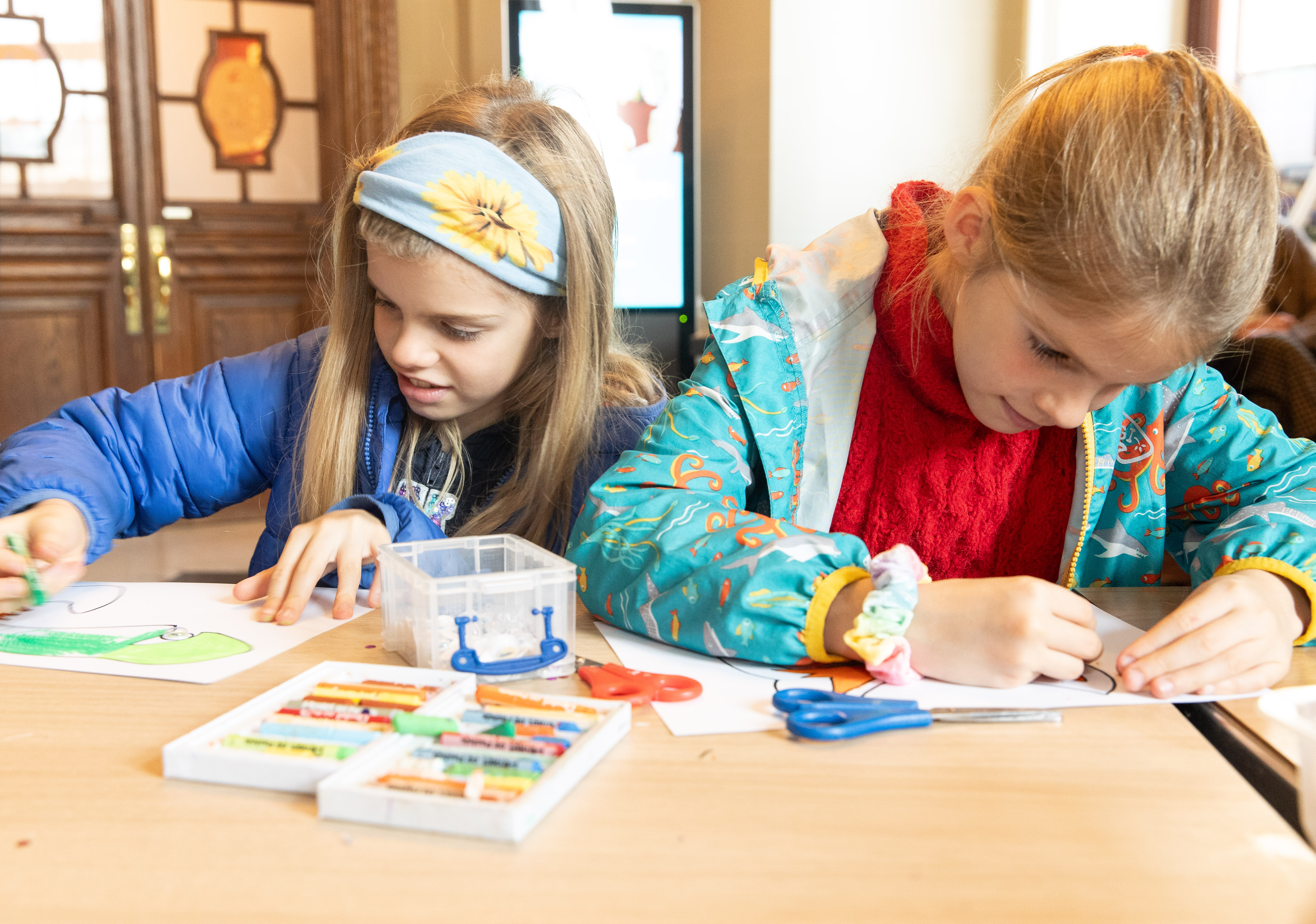 Two young girls doing arts and crafts